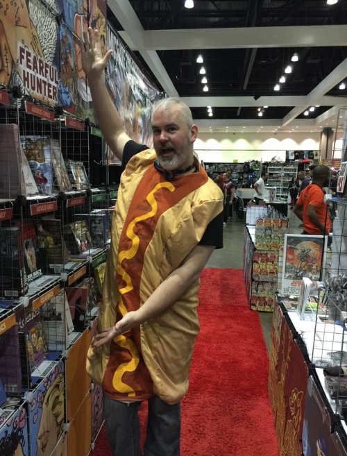 Zan Christensen hot dogs it at his Northwest Press booth.